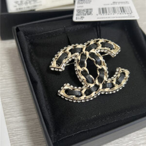 Chanel double c leather brooch