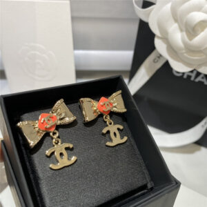 Chanel orange bow lettering earrings