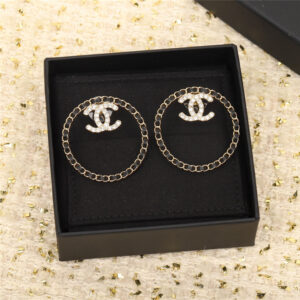 Chanel circle piercing leather double C earrings