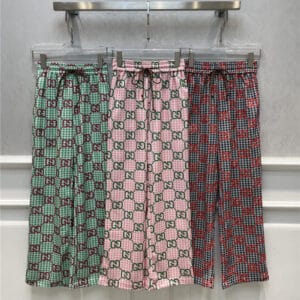 gucci all over letter print casual trousers