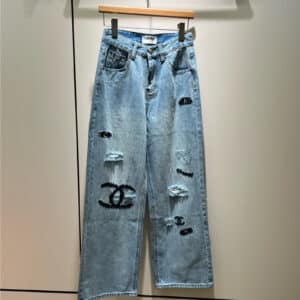 chanel embroidered logo ripped jeans