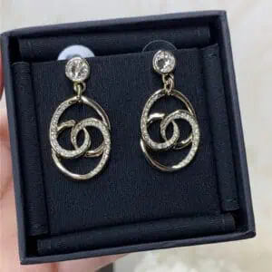 chanel oval twisted double c half diamond earrings